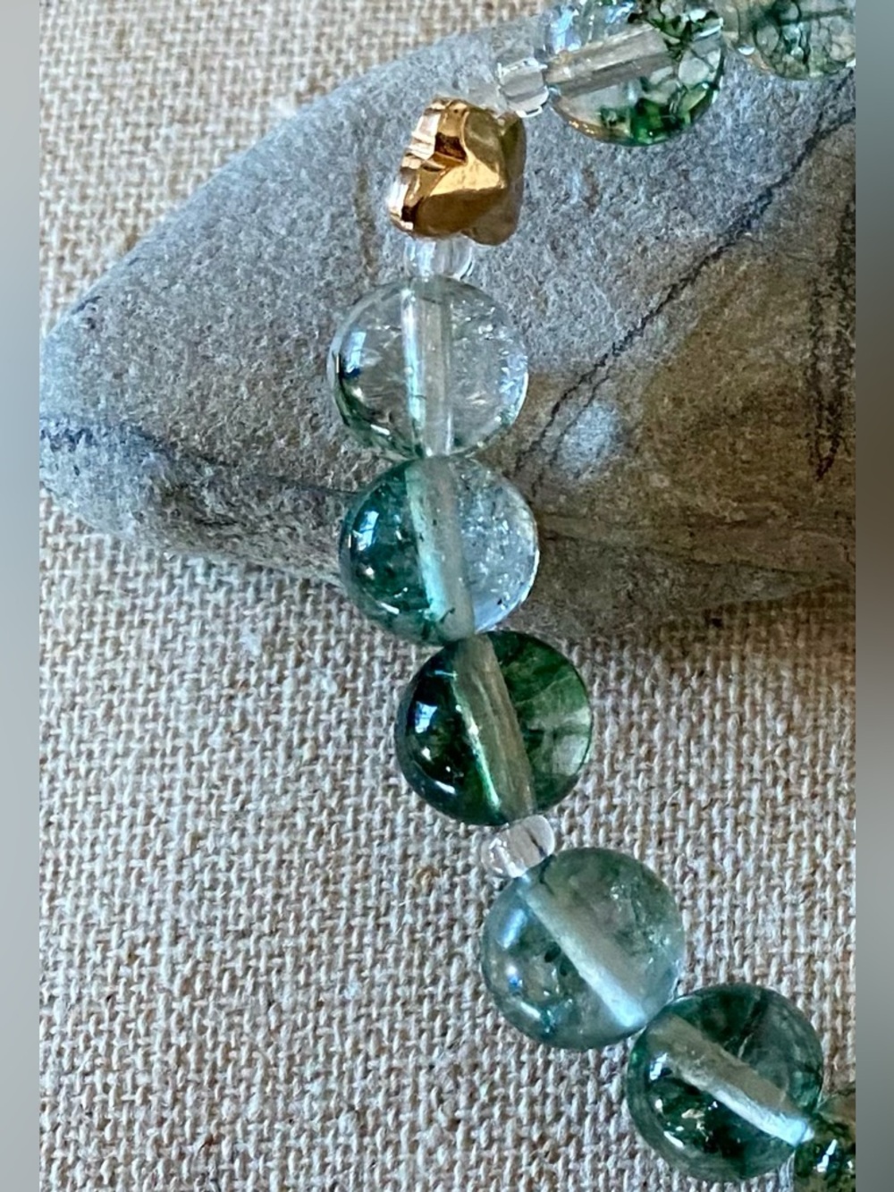 Beaded crystal quartz stretch bracelet with butterfly.
